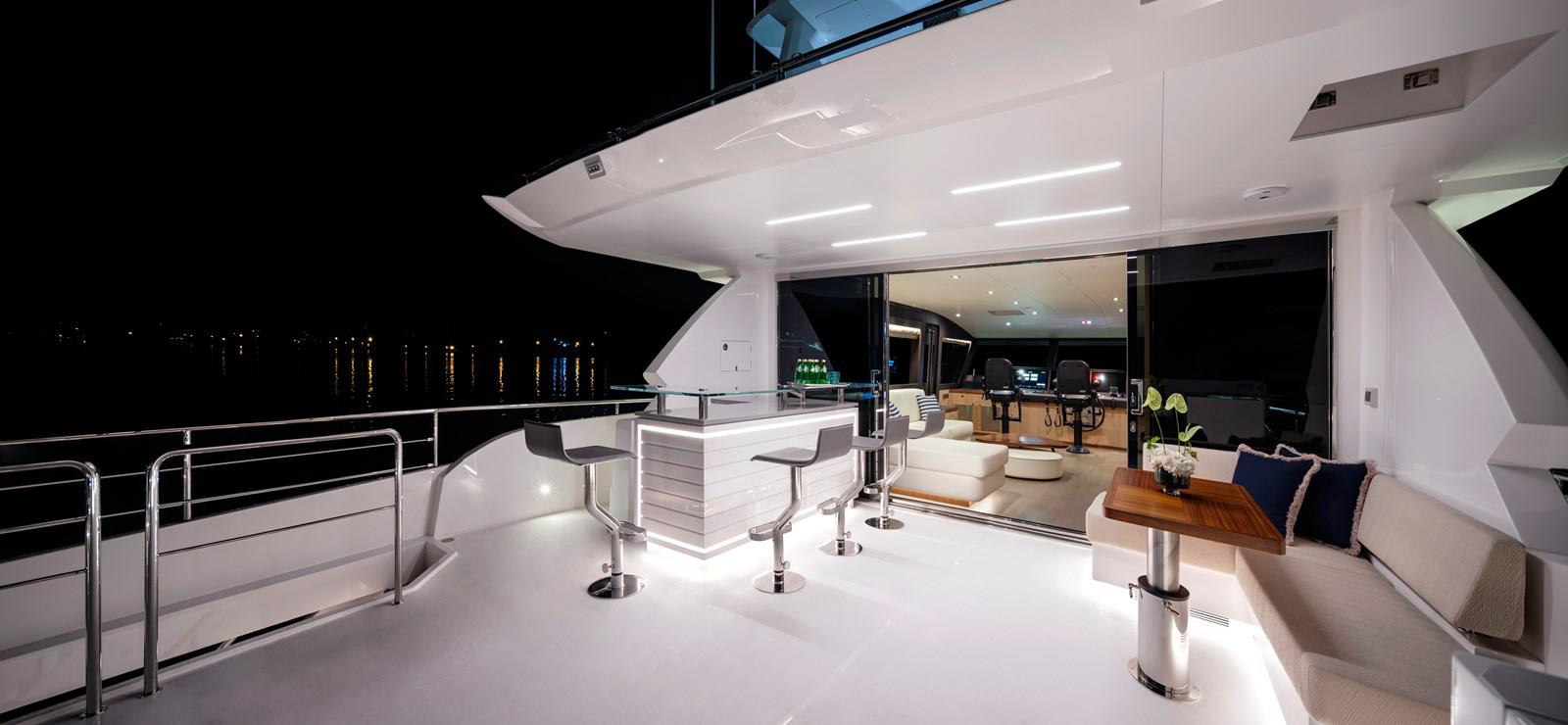 FD87 Aqua Life boat deck with bar, barstools, dinette and view into skylounge.