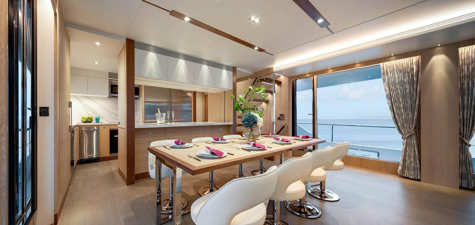 FD87 Aqua Life formal dining area with view of galley.