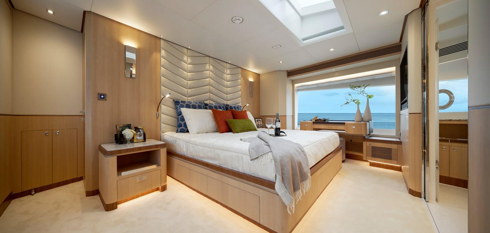 FD87 Aqua Life Master Stateroom with bed, nightstand and desk.