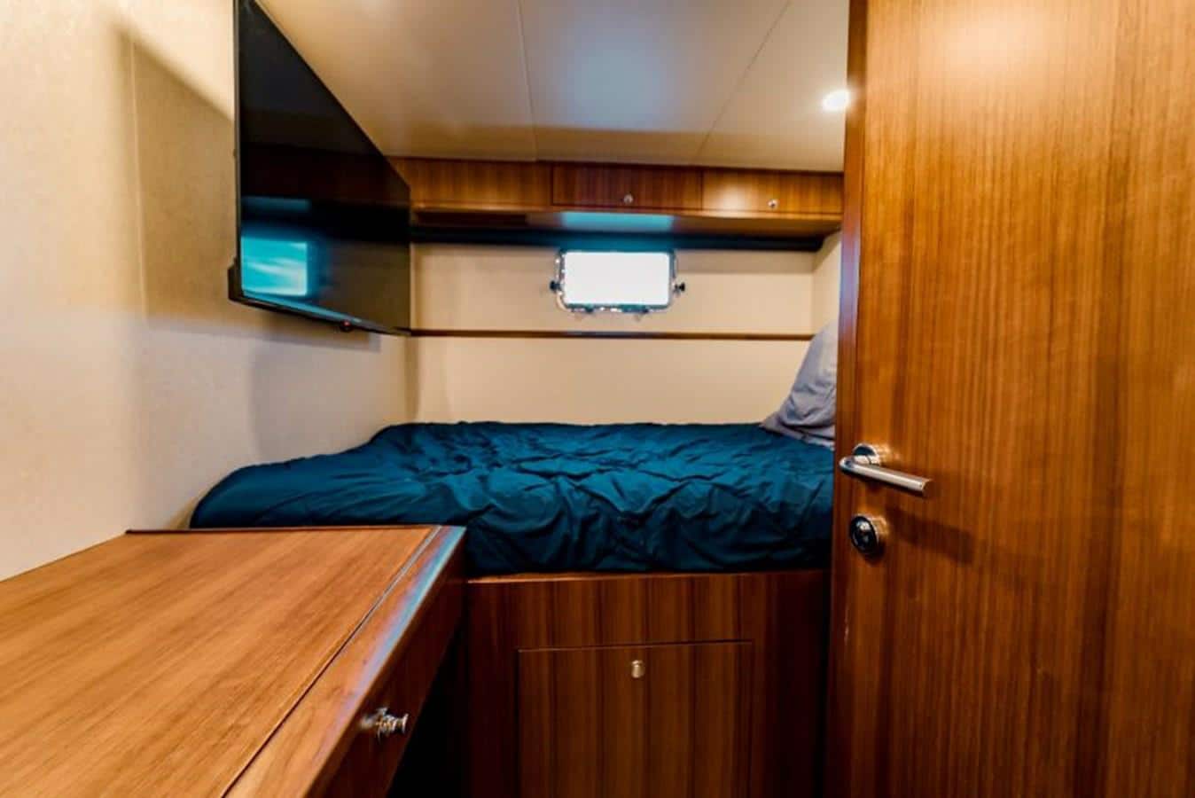 Sweet Salt - Crew Cabin with Blue Comforter and TV - 2016 Ocean Alexander 85e